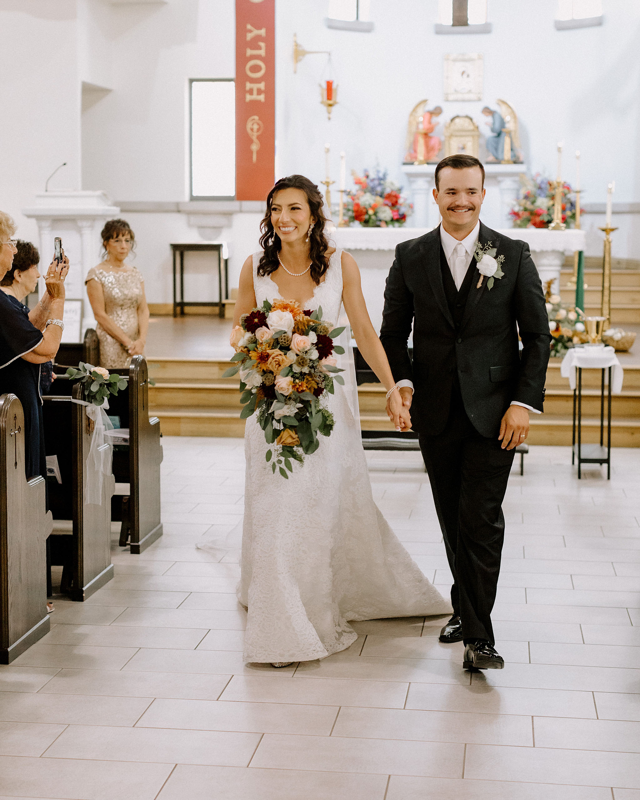 Bride and Groom Walking down the aisle