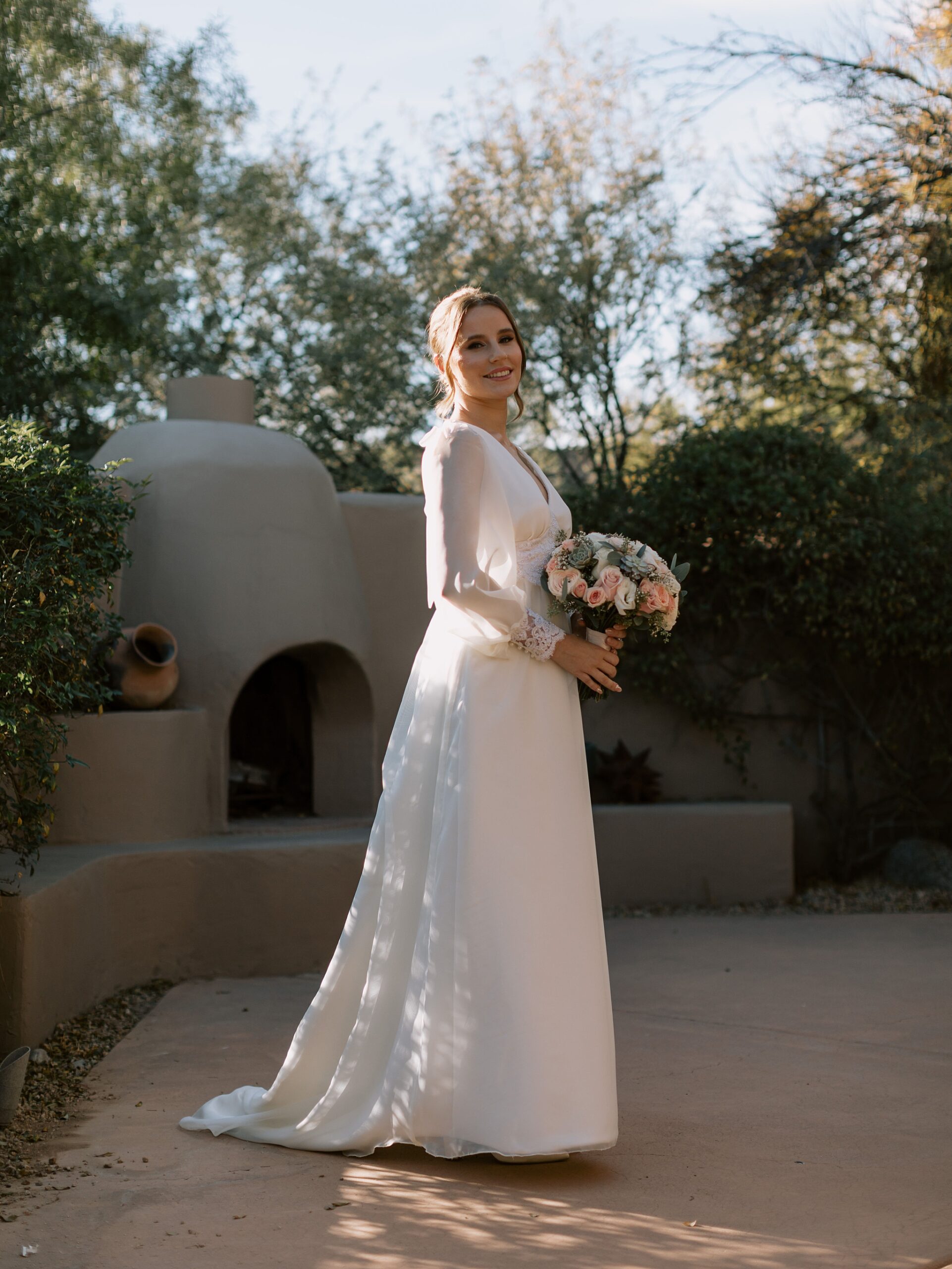 bride’s handmade lace wedding dress, lovingly crafted by her mother, at an intimate desert wedding in Scottsdale.