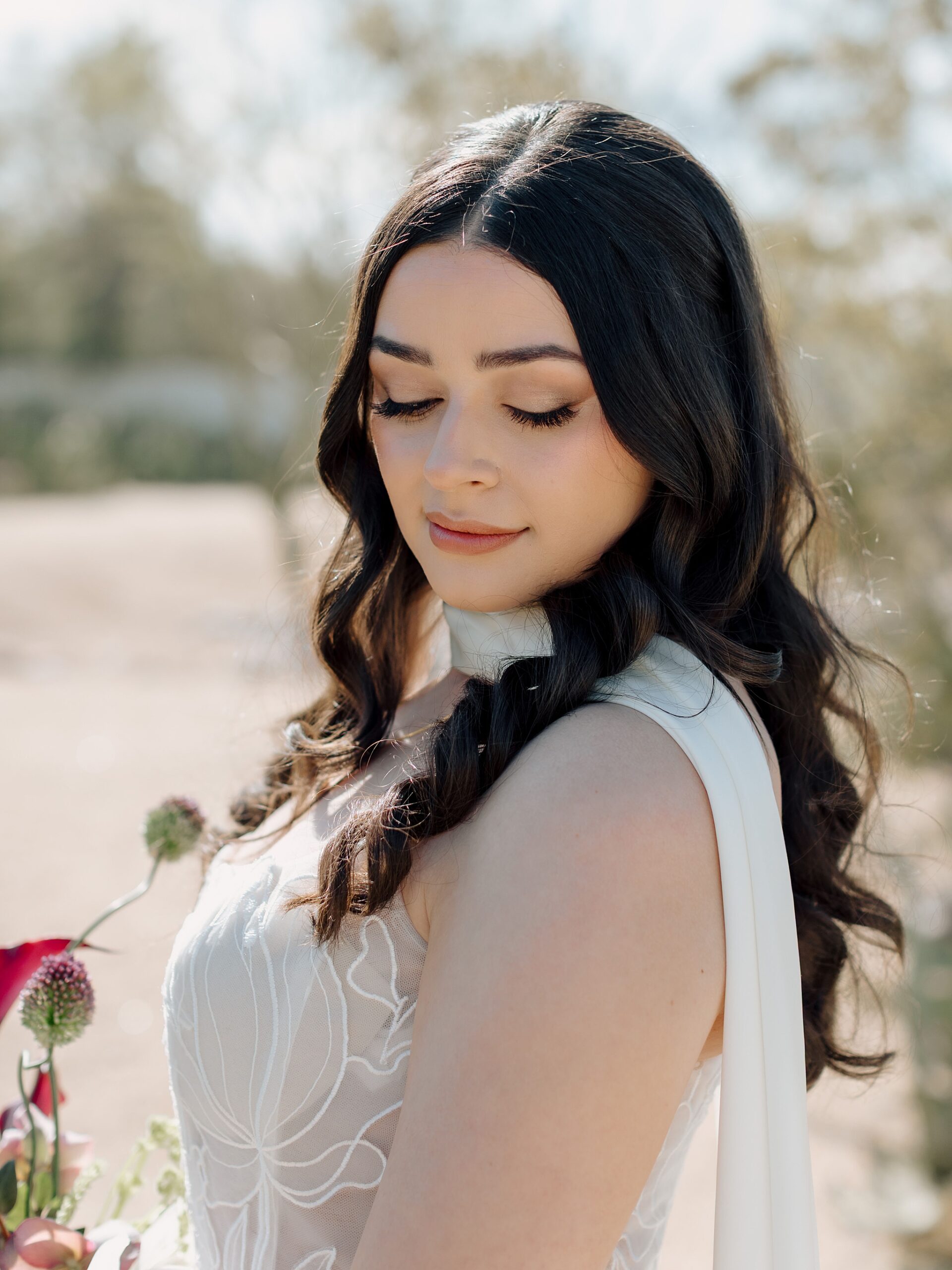Solo portrait of bride in elegant wedding dress and bouquet