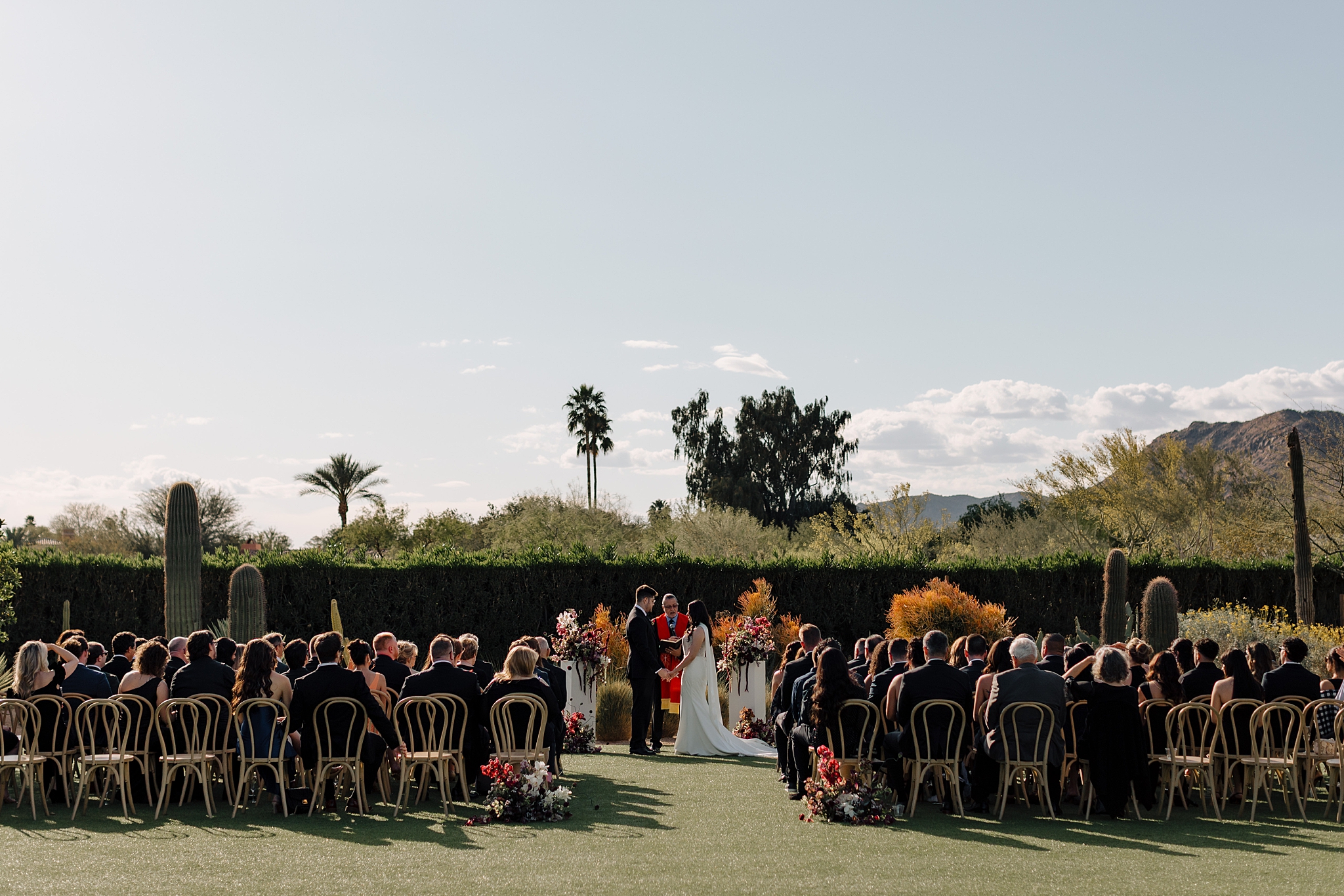 Jake and Reagan exchanging vows at outdoor Andaz ceremony
