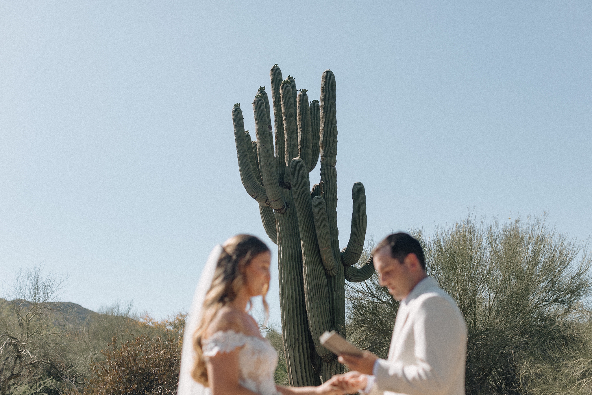 Bride and groom exchanging vows in the Arizona desert