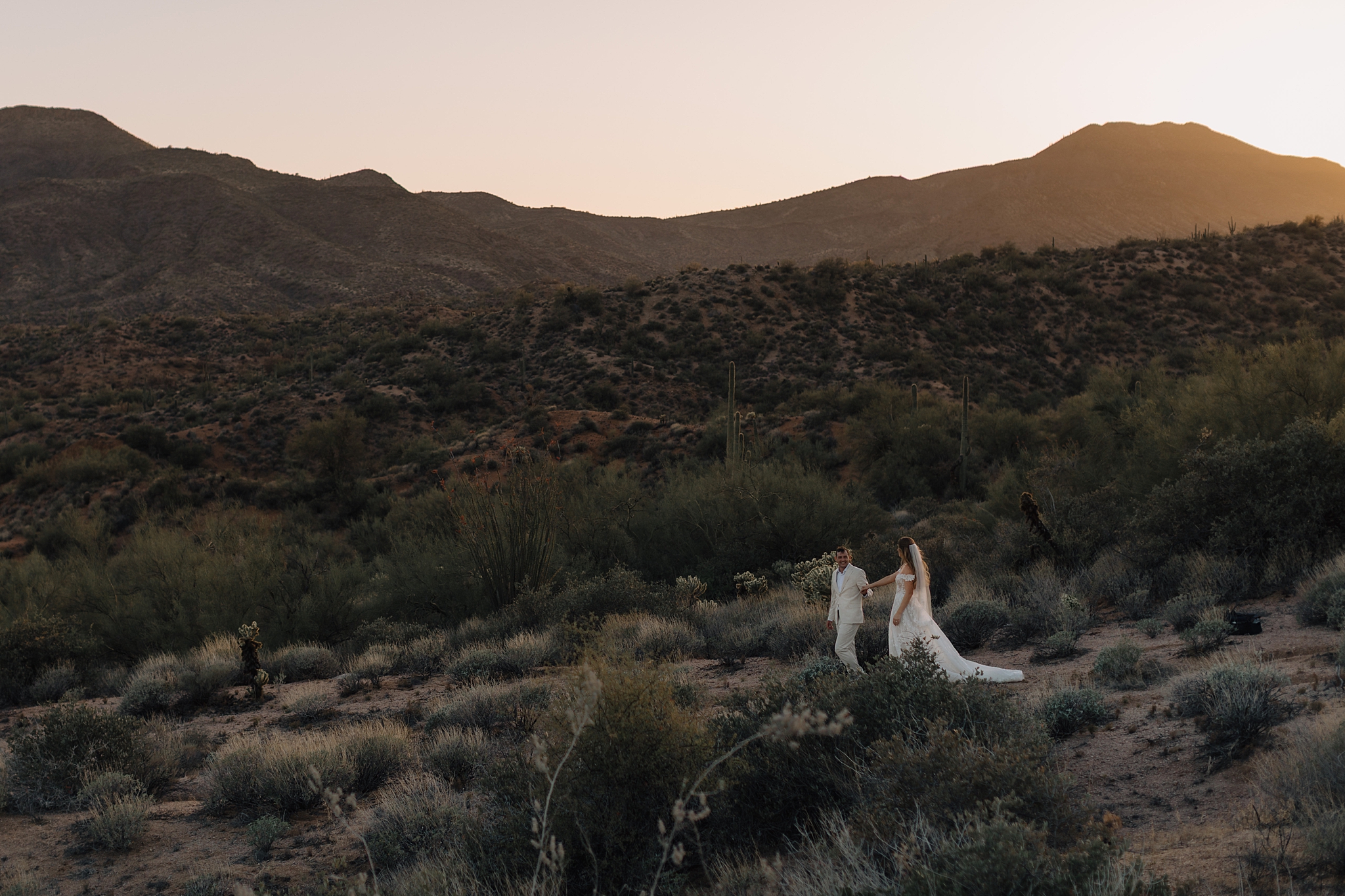 Golden hour light over Arizona wedding couple