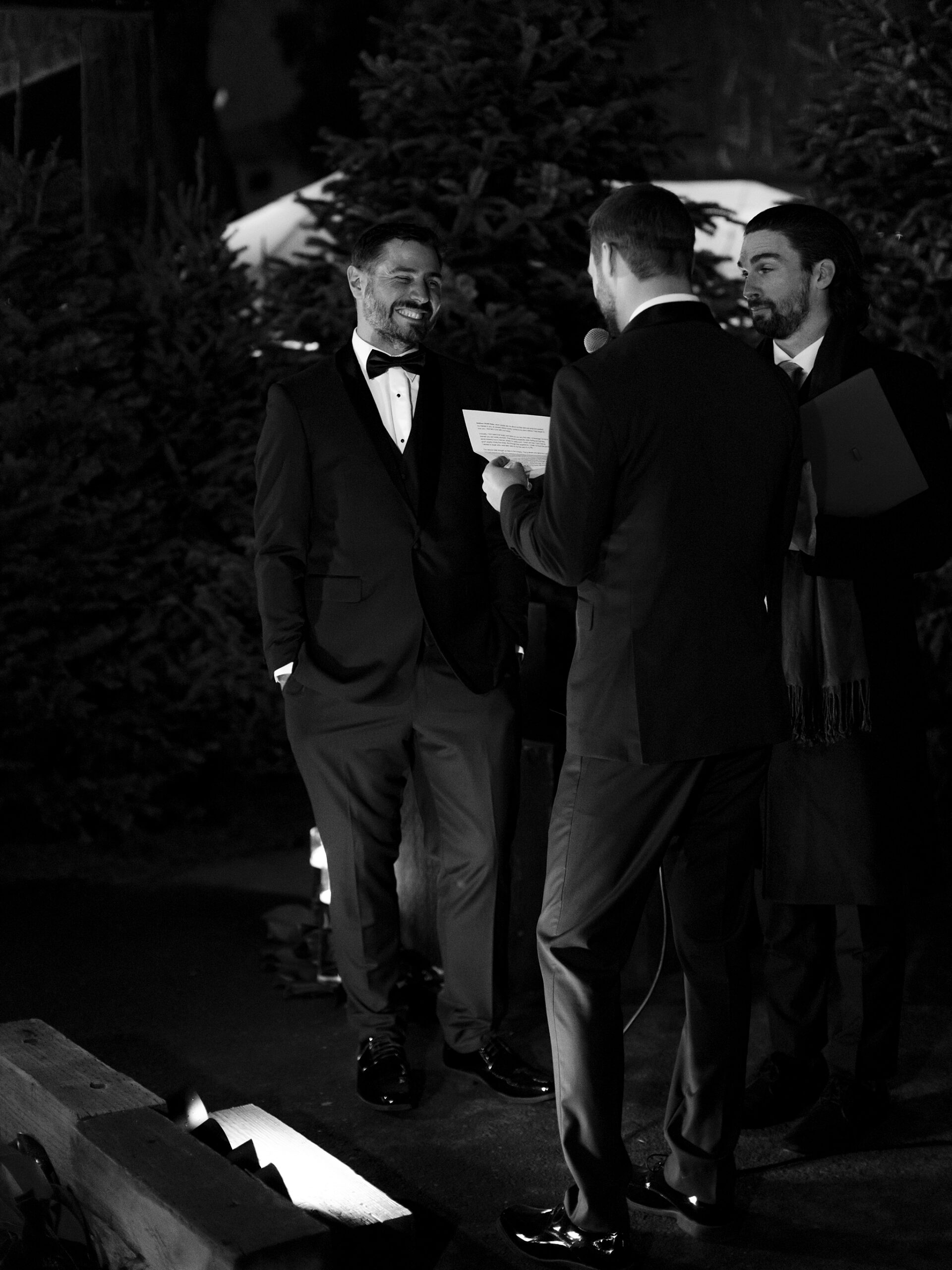 Two grooms at their outdoor candlelit wedding ceremony at Whitfill Nursery in Phoenix