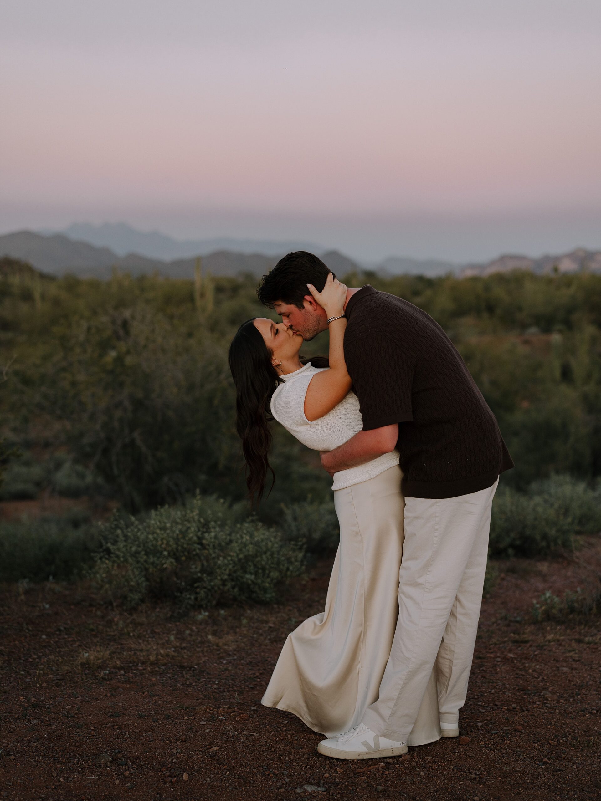 “Sunset engagement photos among saguaros on Bush Highway”