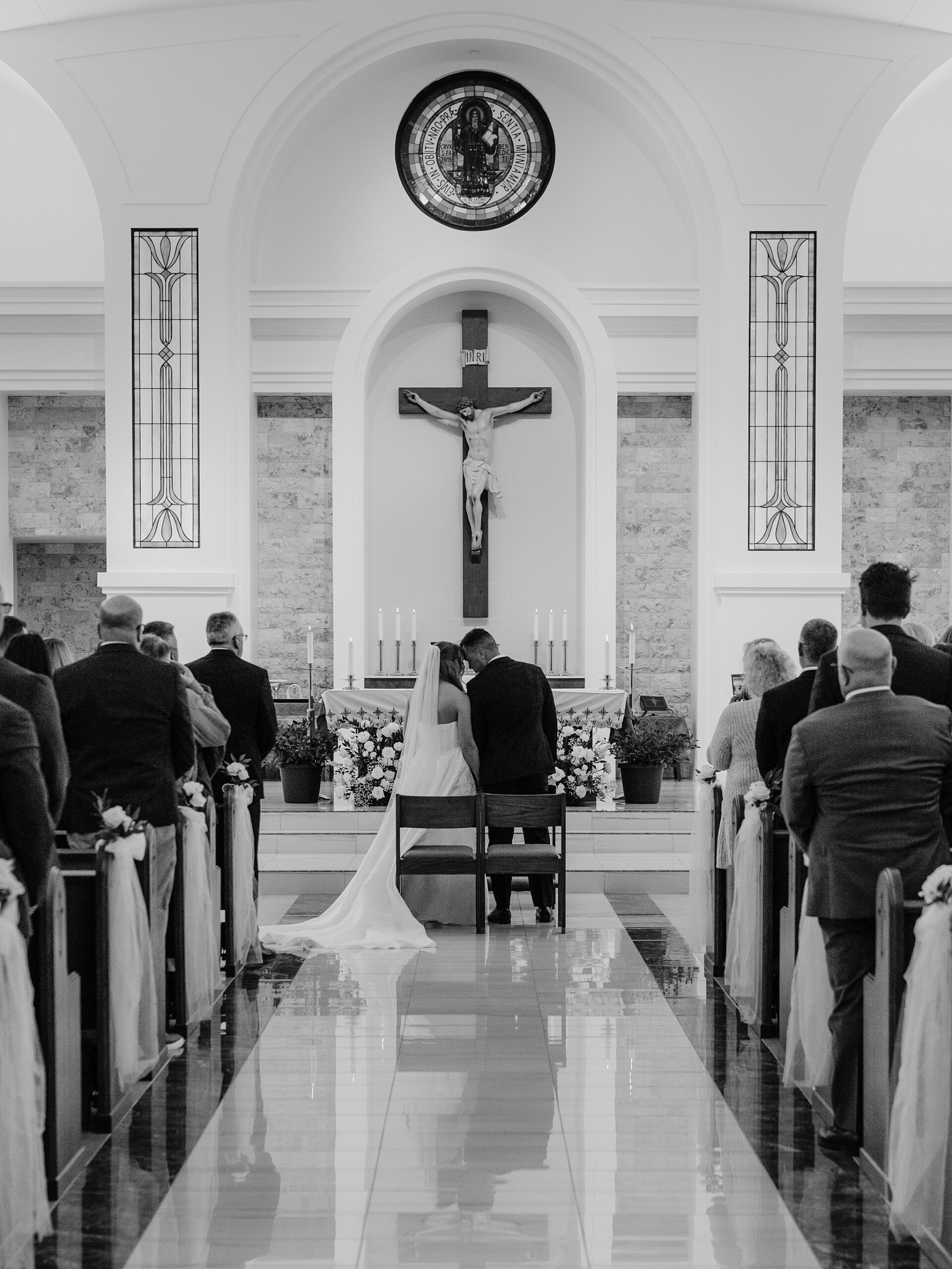 Bride and groom exchanging vows at Saint Benedict Catholic Church Phoenix