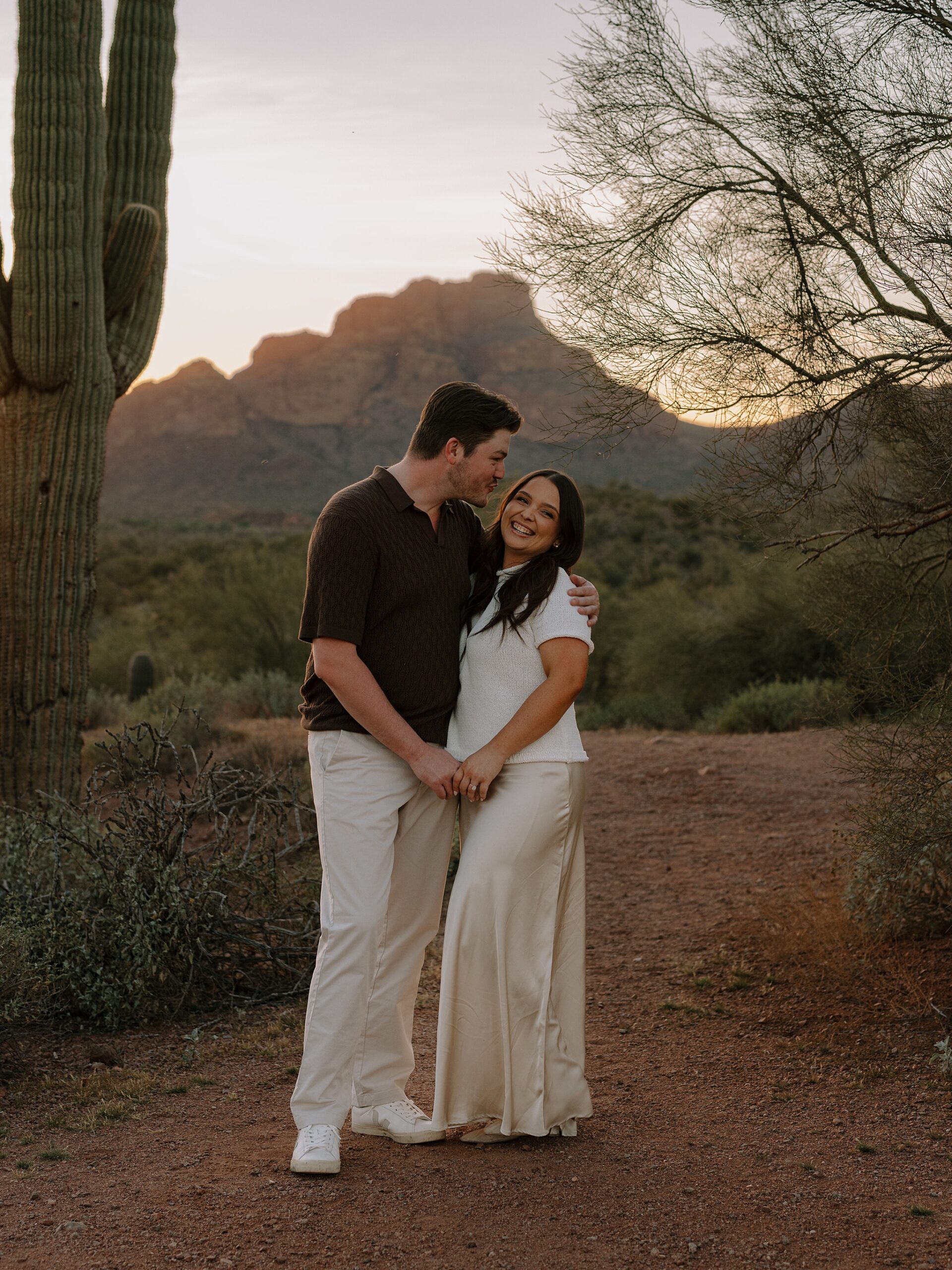 “Sunset engagement photos among saguaros on Bush Highway”