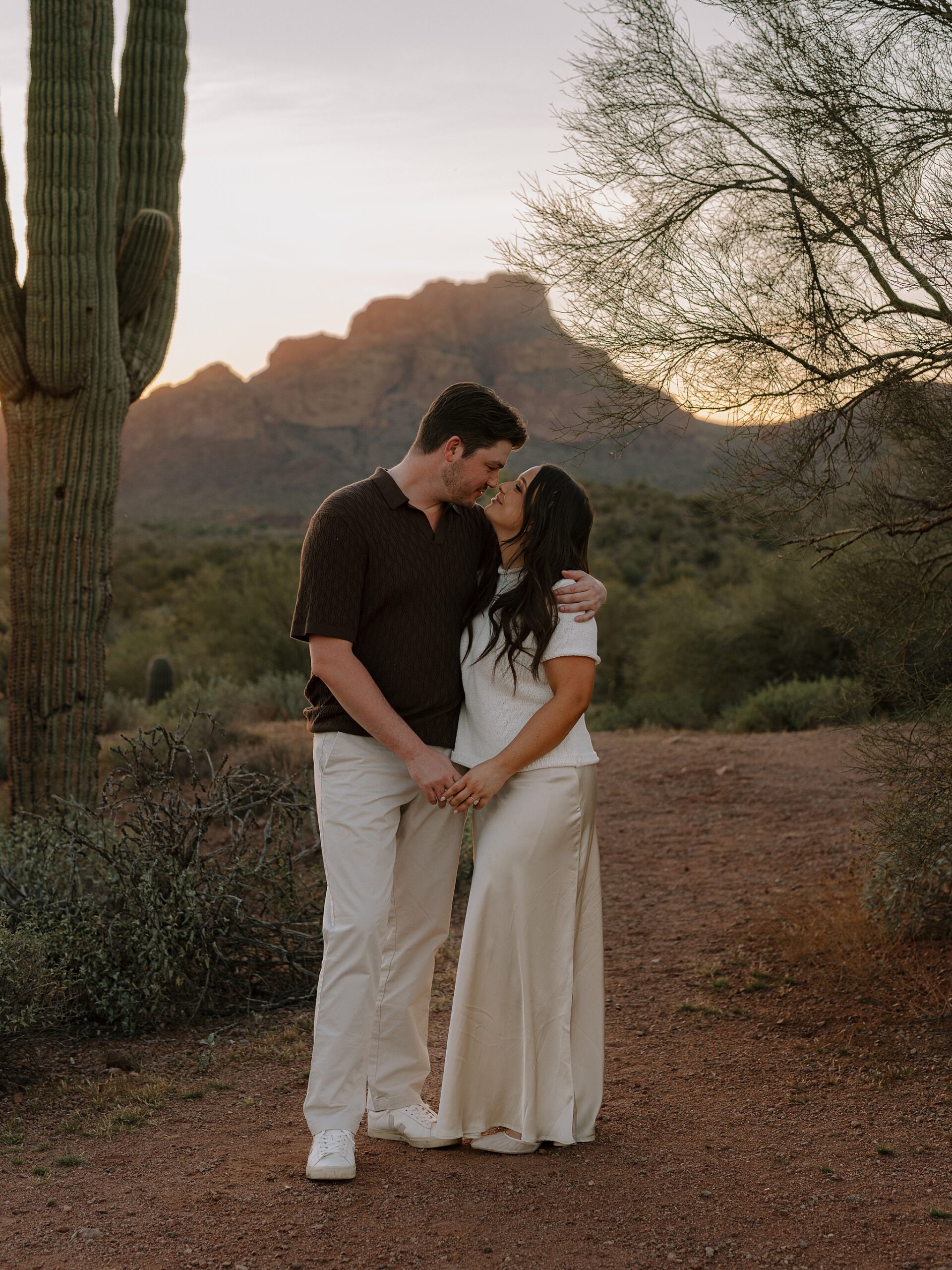 “Sunset engagement photos among saguaros on Bush Highway”