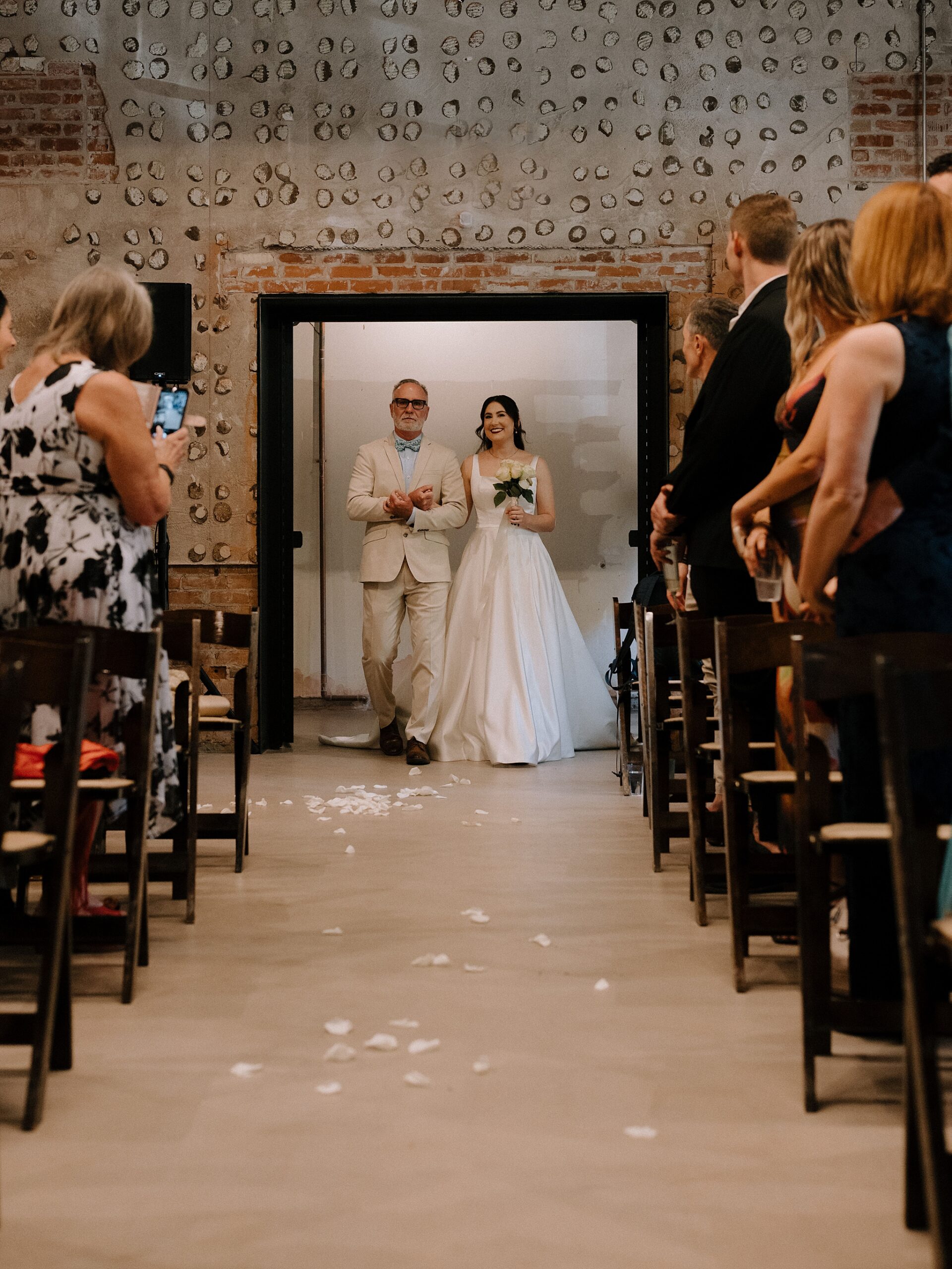 Bride walking down the aisle at the Monroe street abbey in Phoenix, Arizona
