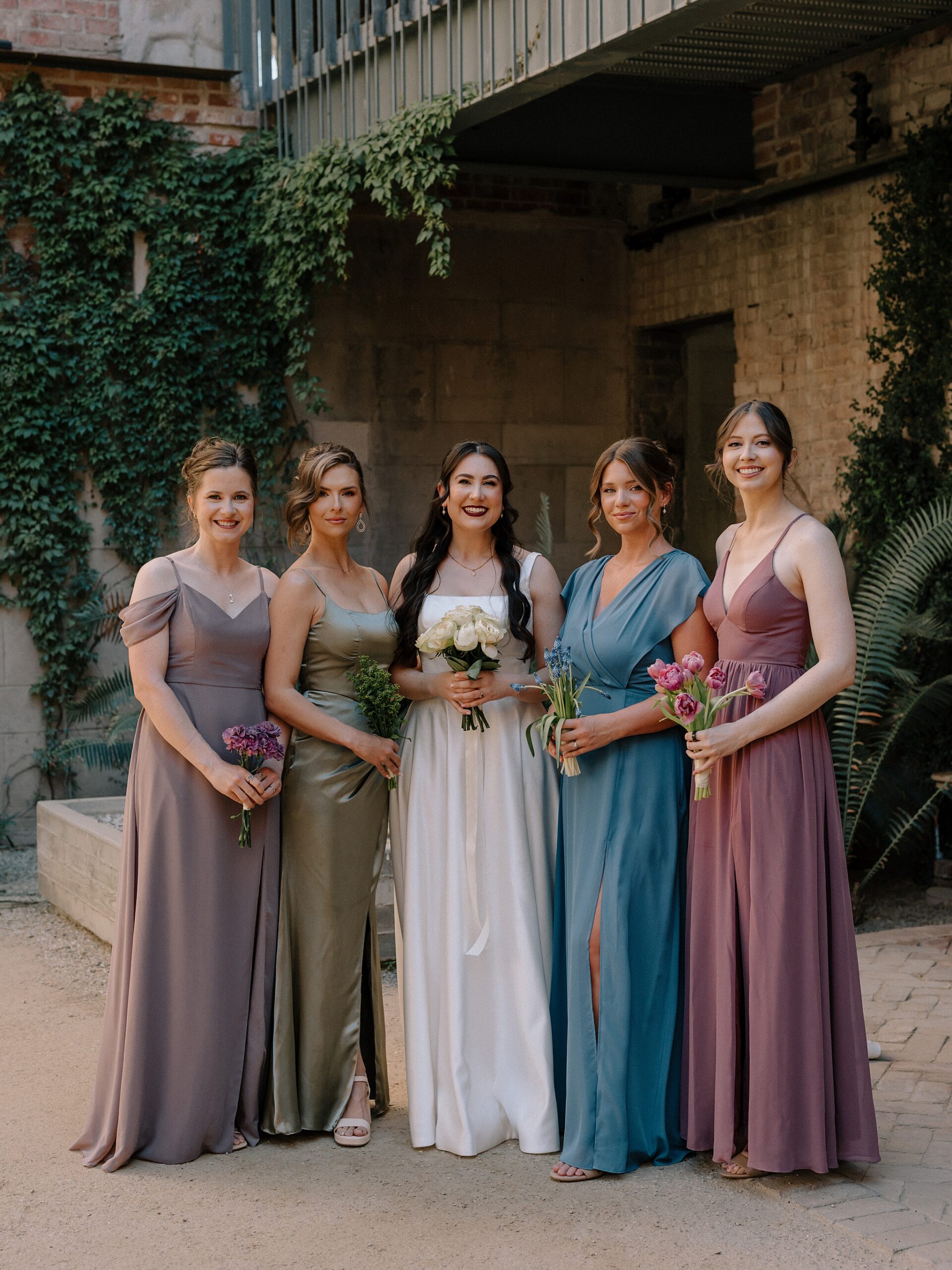 Bride and Bridemaids in the courtyard at the Monroe street abbey in Phoenix, Arizona