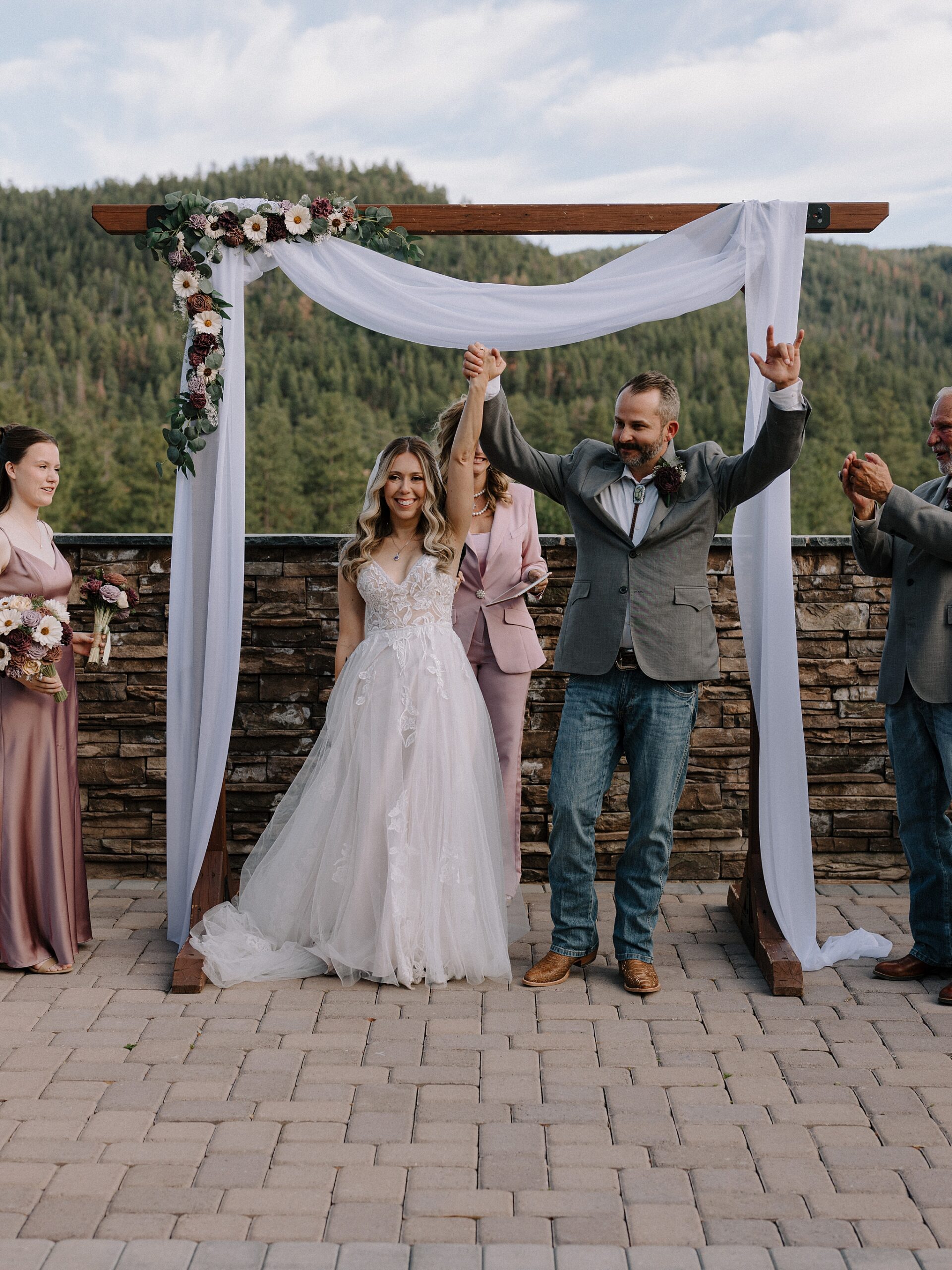 Bride and groom walking back down the aisle after their ceremony at Cabins on Strawberry Hill.